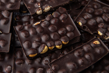 Dark chocolate with hazelnuts. Handmade sweets.