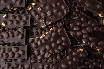 Dark chocolate with hazelnuts. Handmade sweets.