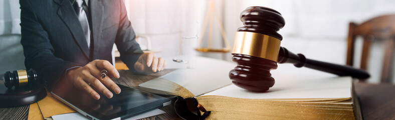 Business and lawyers discussing contract papers with brass scale on desk in office. Law, legal...