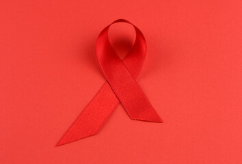 Sign of cancer red ribbon on the table.