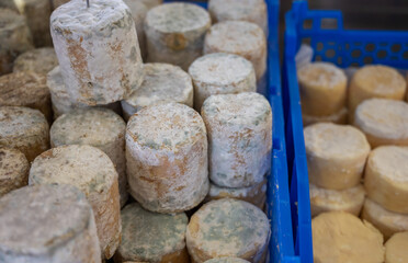 Small pieces of matured goat cheese on French farmers market