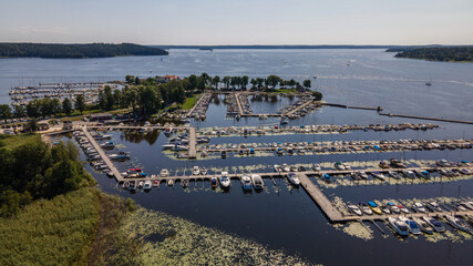Aerial shots of a pier with boats in Ekoln Lake, Sweden