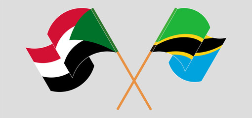 Fototapeta na wymiar Crossed and waving flags of the Sudan and Tanzania