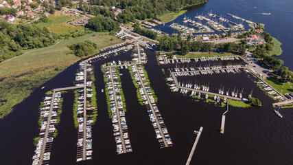 Aerial shots of a pier with boats in Ekoln Lake, Sweden
