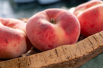 Fresh ripe flat peaches Prunus persica or doughnut peach or Saturn peach