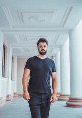 Young beard man posing in the street