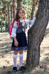 Cute little girl with pink backpack