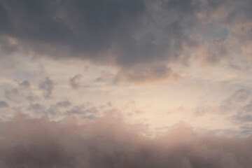 Fototapeta na wymiar view to soft orange sky above fluffy clouds