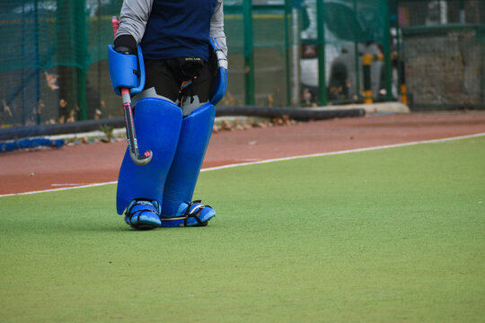 hockey female goalkeeper in a field