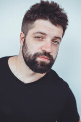 Obraz premium Handsome beard man, outdoor hipster portrait, black t-shirt, street, brutal macho boy