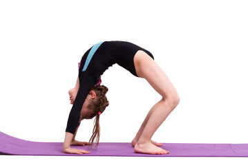 Cute child girl making Gymnastic exercises against white background.