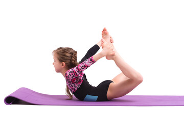 Cute child girl making Gymnastic exercises against white.