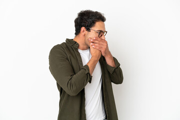 Caucasian handsome man over isolated white background covering mouth and looking to the side