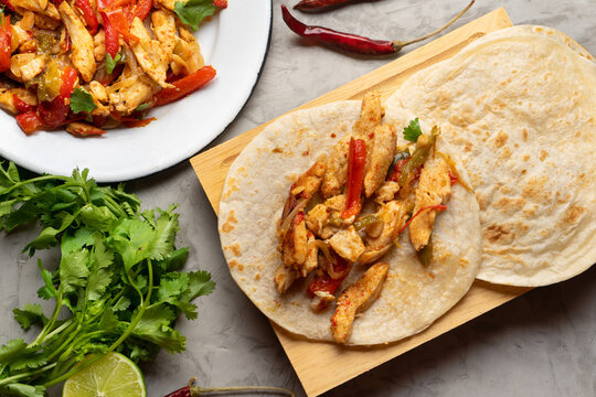 Mexican food. Chicken fajitas on grey background