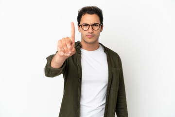 Caucasian handsome man over isolated white background counting one with serious expression