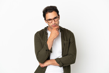 Caucasian handsome man over isolated white background having doubts