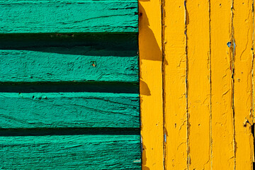 Macro texture of old faded paint on wooden timber planks