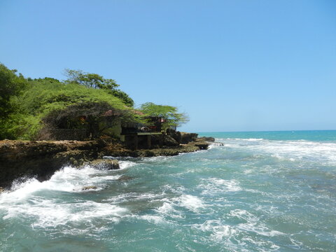 Waves crashing on Caribbean beach in Jamaica 