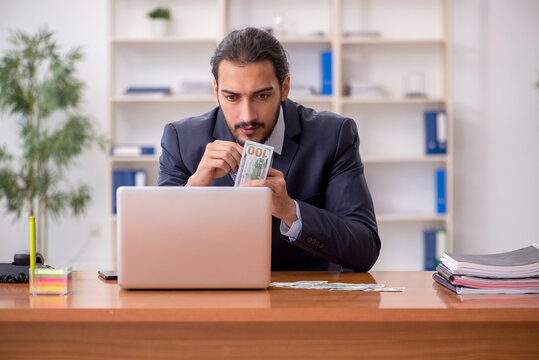 Young Male Employee Playing Cards At Workplace