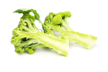 Two halves of organic fresh broccoli cabbage isolated on white background.	