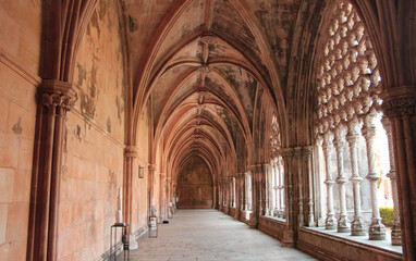 Fototapeta na wymiar Stone arches at the Gothic Cloister inside the Batalha Monastery in central Portugal, a UNESCO World Heritage Site