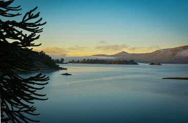 sunrise on the lake and between the mountains