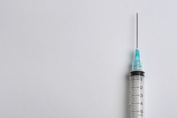 Plastic syringe tip on white background with space for text. Health concept. 