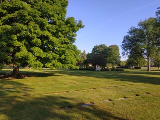 Naklejka premium View on the catholic cemetery at the summer warm morning sun
