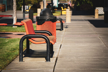 Public bench and trash can
