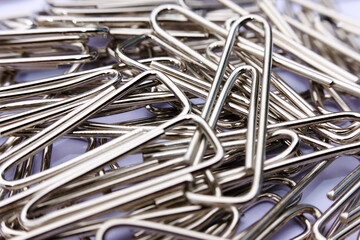 Close up paper clip on white background, and macro paper clip,  office equipment