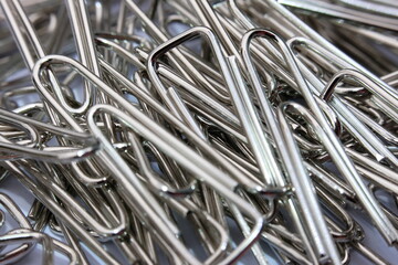 Close up paper clip on white background, and macro paper clip,  office equipment