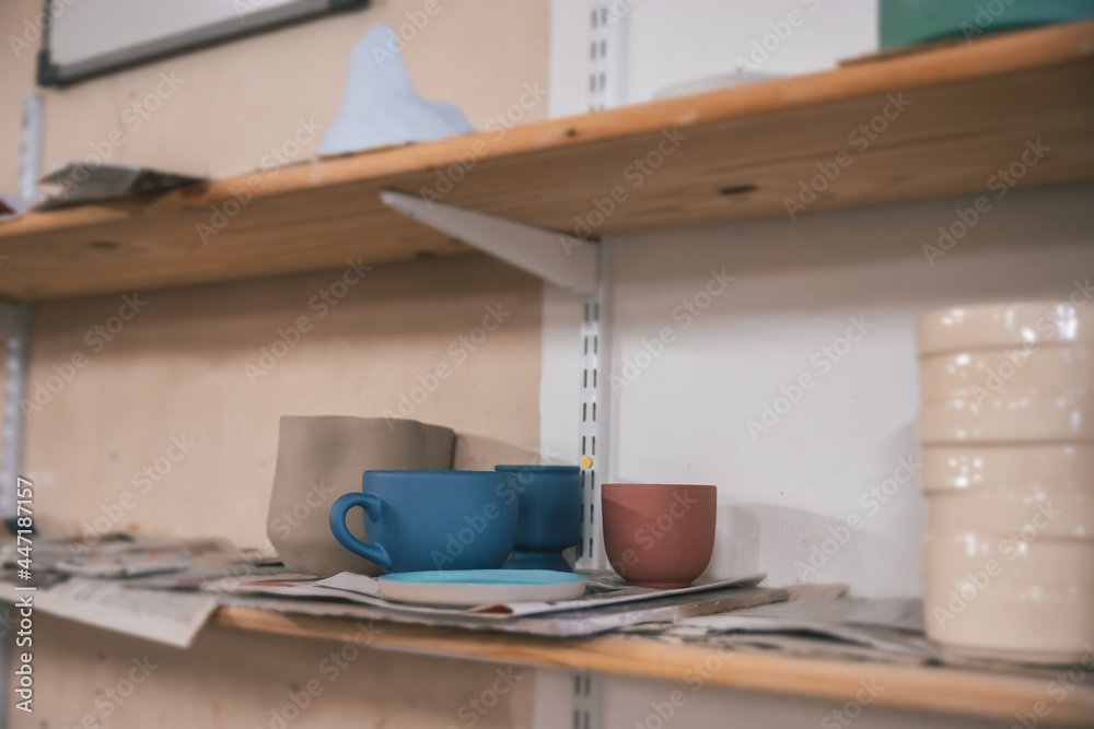 Wall mural ceramic pieces drying in different ways