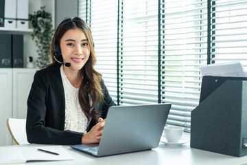 Portrait of beautiful Asian business woman call center work in office. 