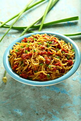 Bowl of delicious ,spicy chicken noodles - Indian street foods background. 