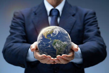 Planet Earth in hand of business man. Businessman hold Global World show Global warming, Save...
