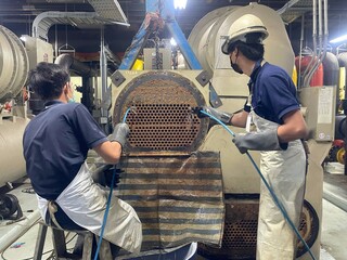 technician cleaning the heat exchanger