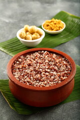 Healthy vegan diet meal- organic red rice with bran porridge - Indian traditional vegetarian foods.