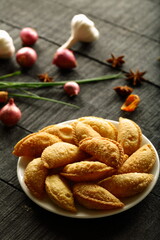 Asian street foods background- spicy curry puff pastry.