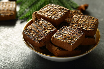 Bowl of delicious homemade chocolate cookies on a holiday background.