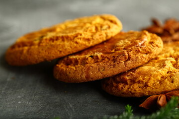 Oven fresh homemade cookies on a rustic kitchen table.