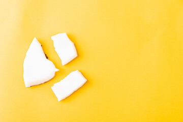 Happy coconuts day concept, fresh coconut group pieces slices, studio shot isolated on yellow background