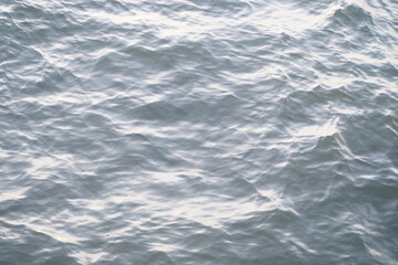 Beautiful top view of blue ocean with ripples and waves for natural and inspirational concept