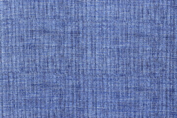 The texture of natural melange fabric is light blue. Abstract simple background of natural coarse fabric.