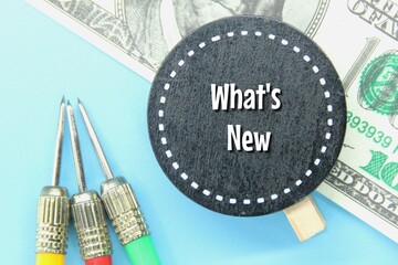 banknotes, arrows, black circles with the words what's new
