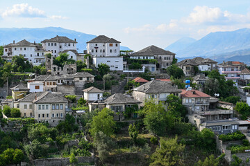 Fototapeta premium View of the old town of Gjirokastra in Albania with the traditional stone roofs, stone house roof 