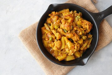 Aloo Gobi Mutter curry, cauliflower, and peas curry. Aloo Gobi masala. Served with wheat roti. famous Indian curry dish with potatoes and green peas. Copy space