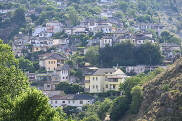Fototapeta na wymiar View of the old town of Gjirokastra in Albania with the traditional stone roofs, stone house roof 