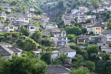 Fototapeta premium View of the old town of Gjirokastra in Albania with the traditional stone roofs, stone house roof