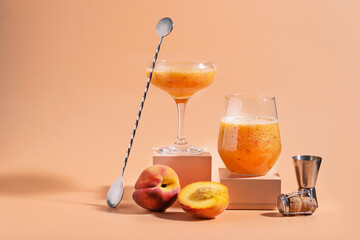Summer refreshing fruit cocktail bellini of fresh ripe peach and champagne in glasses on modern...