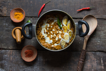 North Indian delicacy Chicken bharta prepared with shredded chicken, eggs, butter, cream along with Indian spices. A spicy rich gravy chicken dish. Top view. 